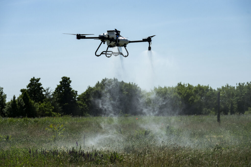 ABZ Innovation L30 V2 agricultural drone in active spray operation